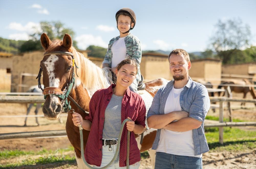 Family riding horses, Pampas, Argentina