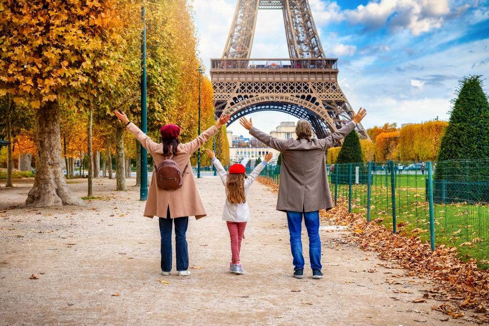 Happy family at the Eiffel Tower, Paris, France
