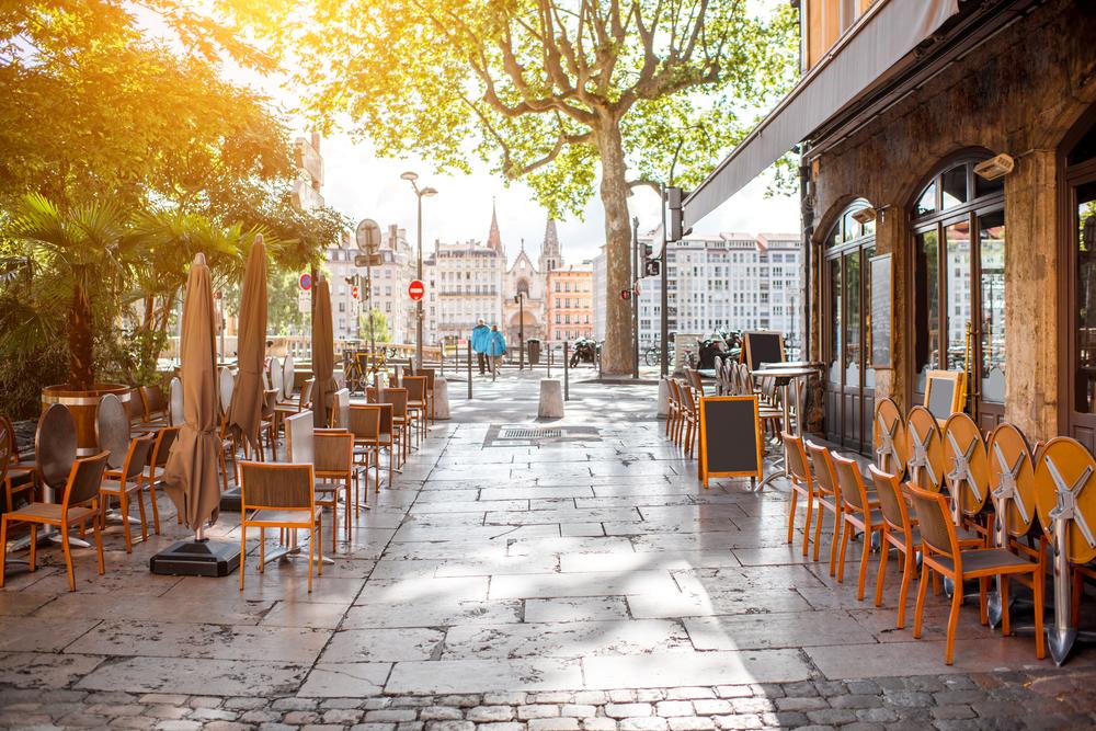 Street view with cafes near the river, Lyon, France