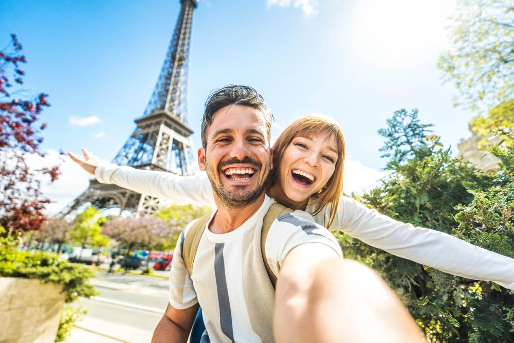 Happy tourist couple, Paris, France