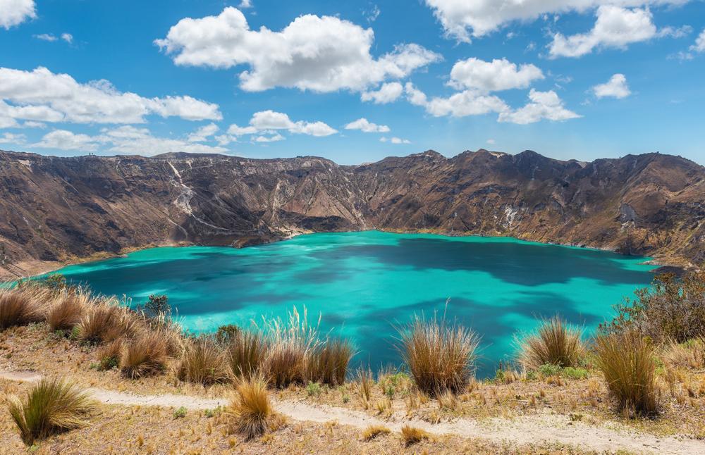 Quilotoa volcanic crater lagoon with turquoise waters and Quilotoa Loop trail near Quito, Ecuador