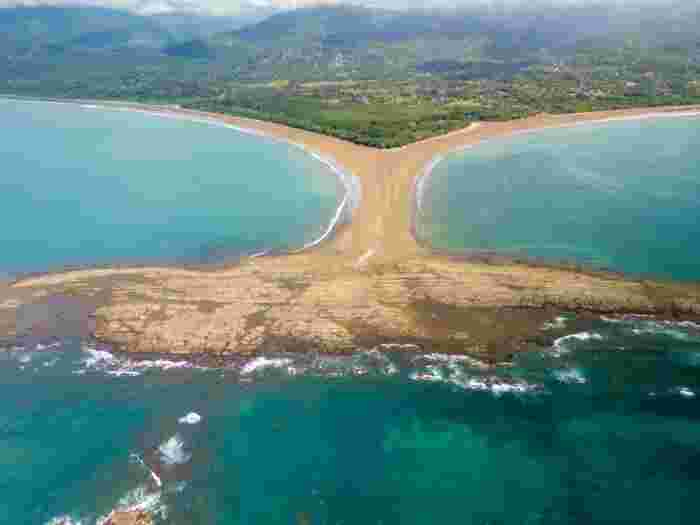 Aerial view of Marino Ballena National Park sandbar shaped like a whale tail
