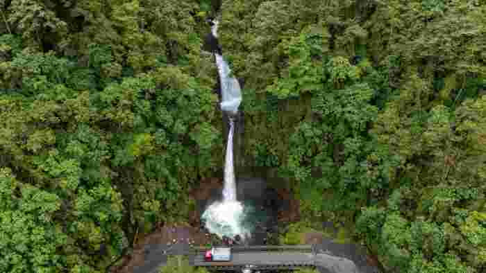 La Paz waterfall cascading through dense green rainforest in Costa Rica