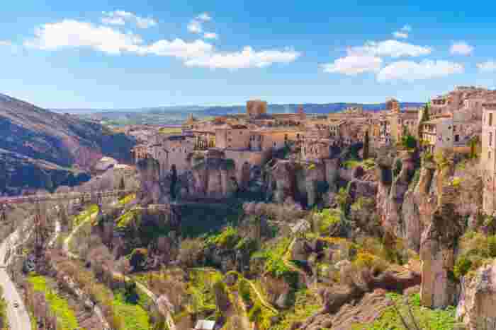 Scenic view of the historic cliffside town of Cuenca, Spain, perched above the Huécar River gorge on rocky cliffs 