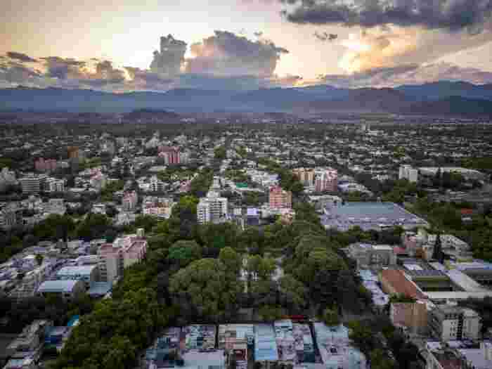 Aerial view of Mendoza city with Andes mountains at sunset, Argentina 