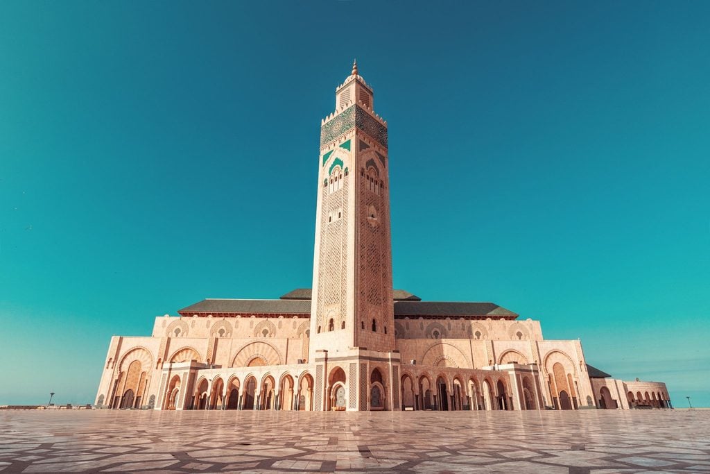 Hassan II Mosque and its towering minaret against a clear blue sky