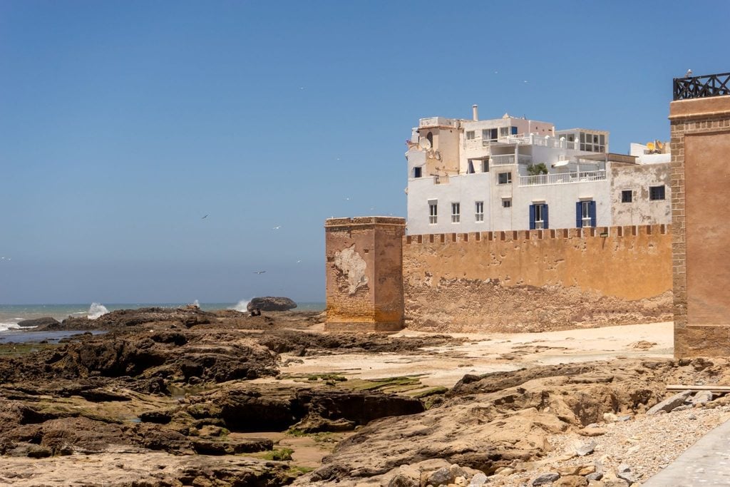 Whitewashed ramparts of Essaouira overlooking a rocky Atlantic shoreline 