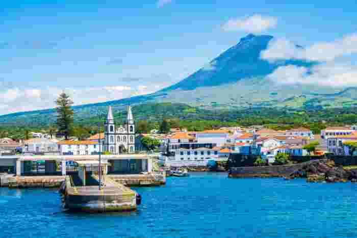 View,Of,Madalena,Port,And,Volcano,On,Coast,Of,Pico View of Madalena port and the Pico volcano on the coast of Pico Island in the Azores, Portugal