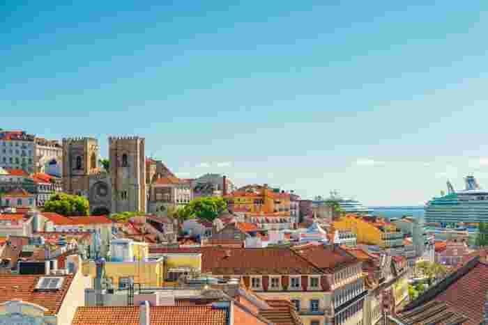 View,Of,Lisbon,Cathedral,And,Colorful,City,Buildings,With,Cruise View of Lisbon Cathedral and the colorful city buildings of Lisbon, Portugal