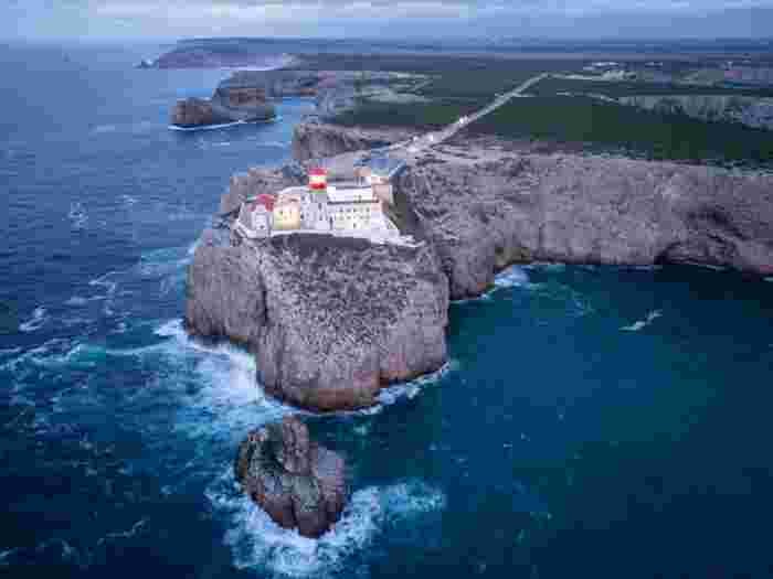 Cape,Saint,Vincent,,Lighthouse,,Cliffs,And,Atlantic,Ocean,In,Evening Cape St. Vincent lighthouse on the cliffs above the Atlantic Ocean in the Algarve, Portugal